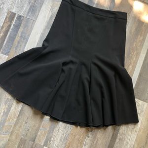 Flare, calve length black skirt.